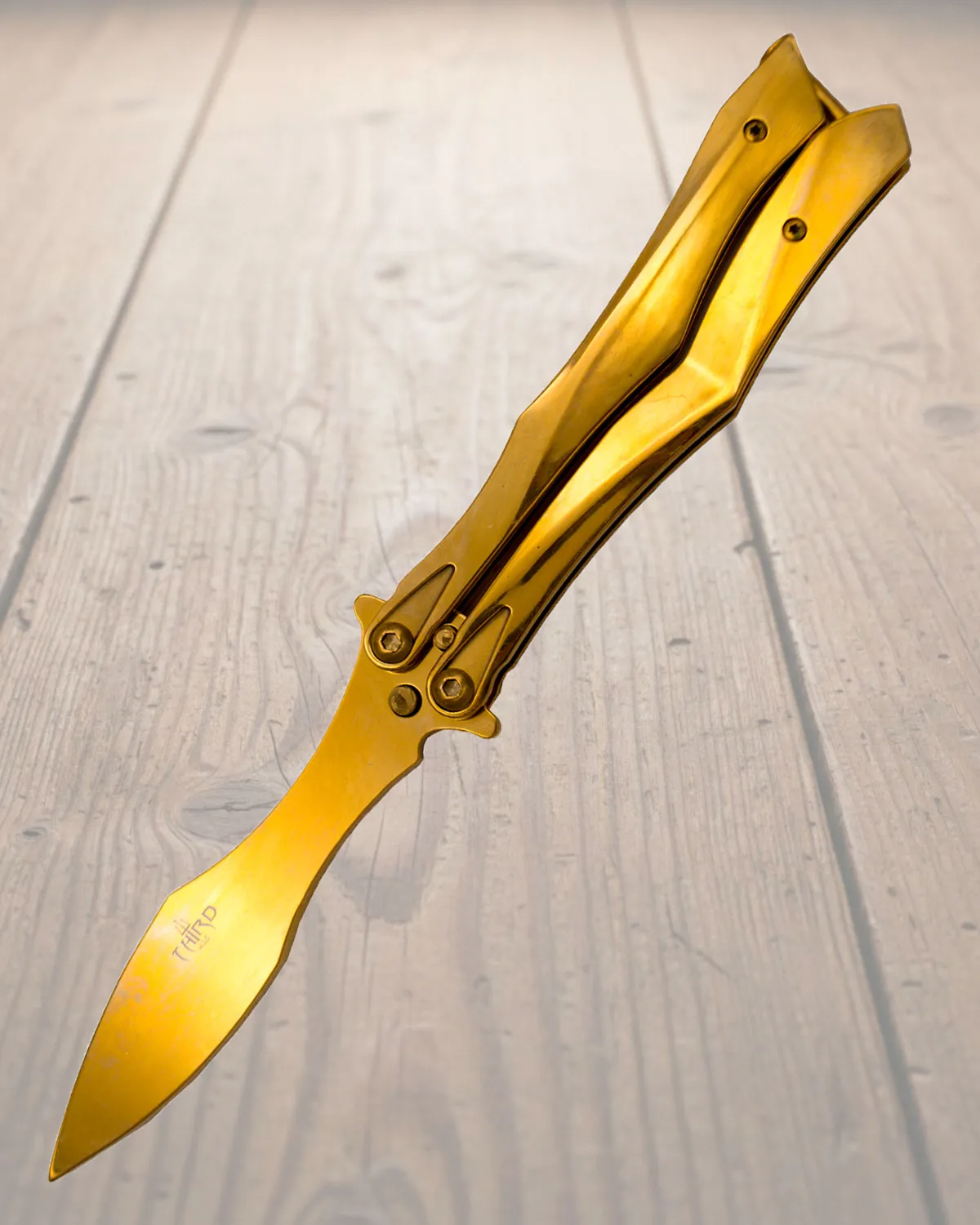 Navaja mariposa entrenamiento sin filo titanio oro